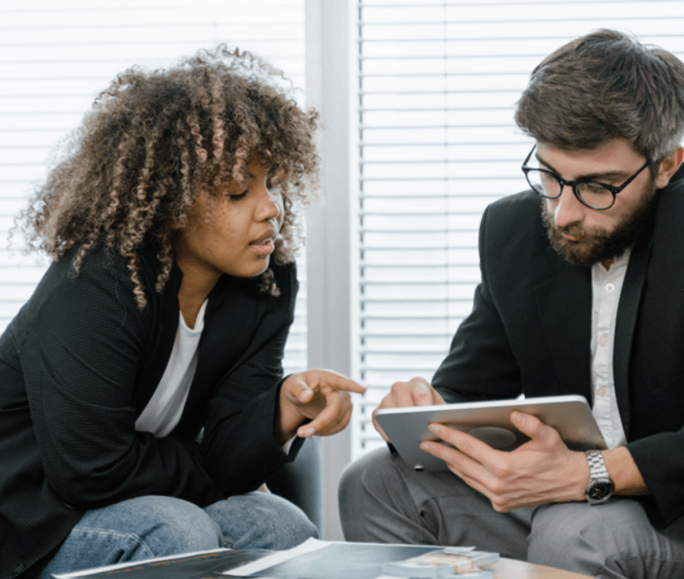 Man and Woman looking at secure tablet