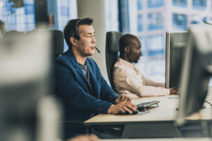 Two men sitting at desks with computers