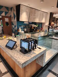 POS stands on secure display at Maxcess