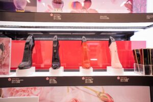 A fragrance tester display with security solutions that secure each tester while enhancing the beauty brand and allowing customers to interact with the perfumes