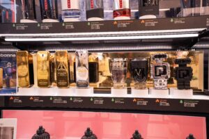 A fragrance tester display with security solutions that secure each tester while enhancing the beauty brand and allowing customers to interact with the perfumes