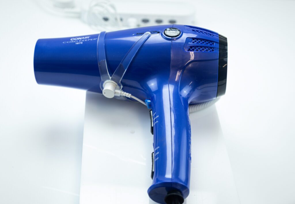 Security device protecting hair dryer from theft.
