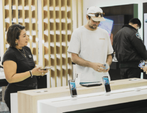 Handling a smartphone on a security display at a Samsung store
