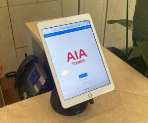 White tablet on black tablet stand in AIA Tower