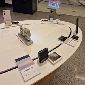 White table with mobile devices on security stands