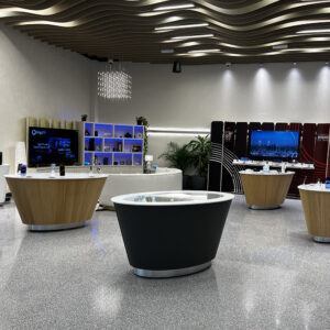 White table with mobile devices on security stands
