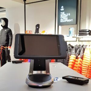 Mobile tablet stand in retail store