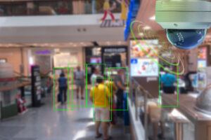 AI-enabled CCTV camera tracking shoppers in a retail store for loss prevention monitoring.