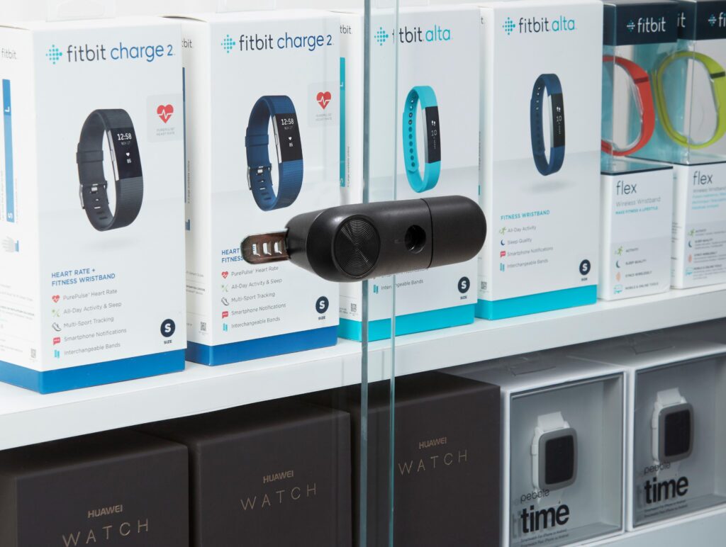 Close-up of InVue LIVE Slider Lock securing sliding glass doors on a wearables display case