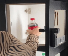 Hand opening a locker with concession products