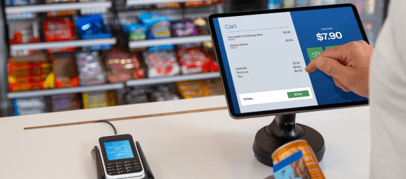 Hand putting in an order on a tablet stand