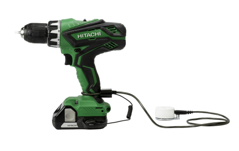 Zips securing a green Hitachi drill