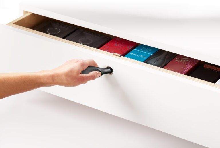 Self-latching drawer lock for retail inventory protection. OneKEY Smart Access