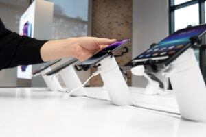 OnePODs with phones and a hand