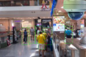 AI surveillance camera tracking shoppers in retail store for loss prevention monitoring.