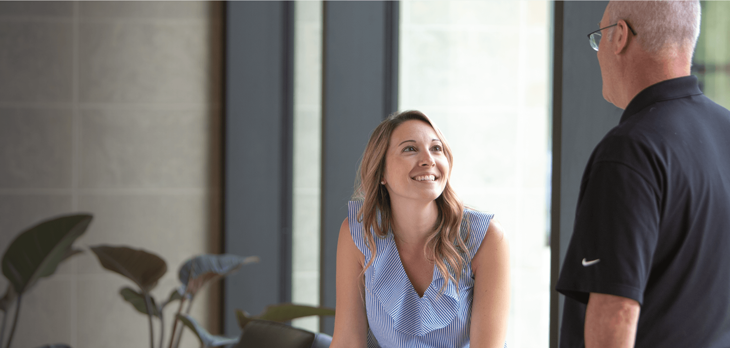 Male and female employee smiling at InVue