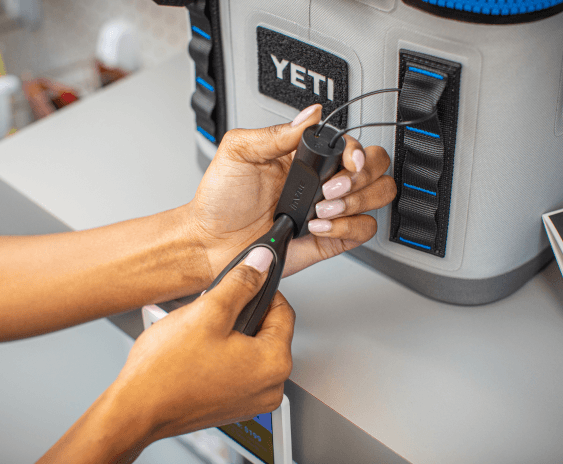 OneKEY unlocks a lock on a Yeti cooler