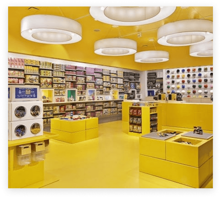 Brightly colored yellow interior of a Lego Store