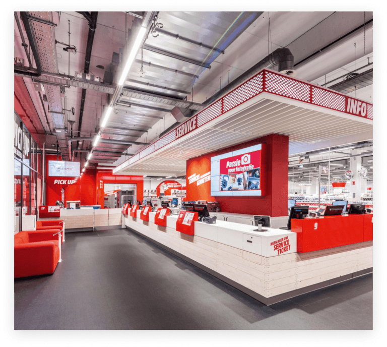 Red and white product displays in a MediaMarkt