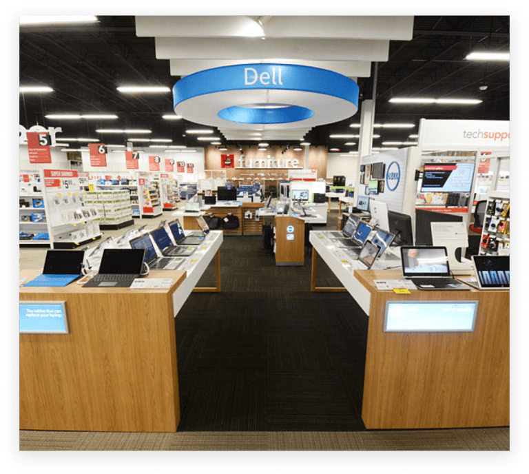 Dell computers on secure display on tables in Office Depot