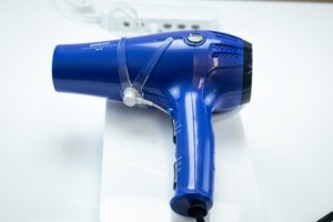 Security device protecting hair dryer from theft.