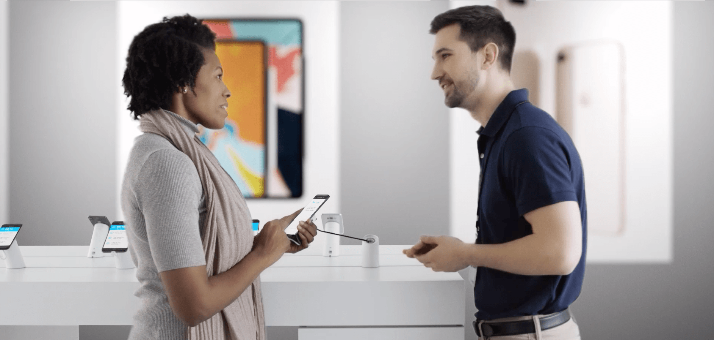 Woman and man looking at phones with secure solutions