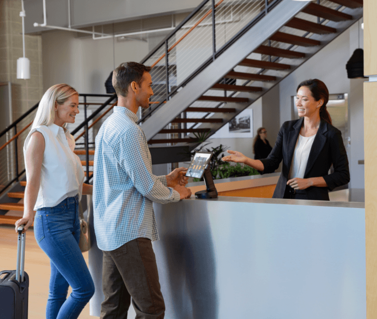 Man and woman with employee and POS tablet system