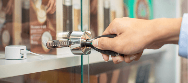 OneKEY unlocks a smart lock on a glass cabinet door