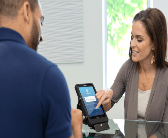 Man and woman looking at handheld mobile point of sale