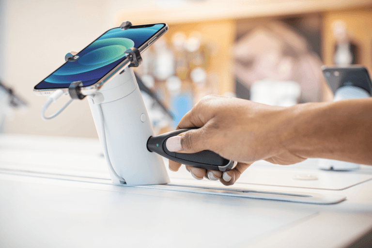 OneKEY unlocking a OnePOD holding a phone