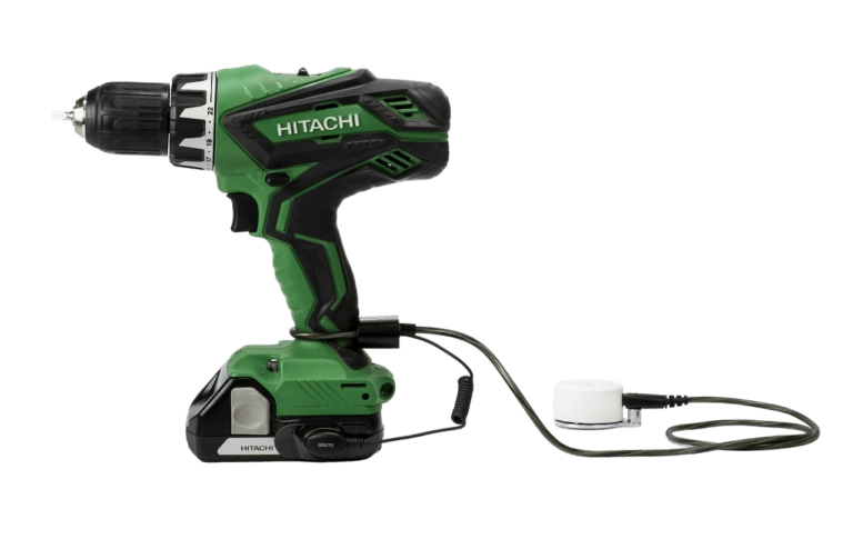 Zips securing a green Hitachi drill