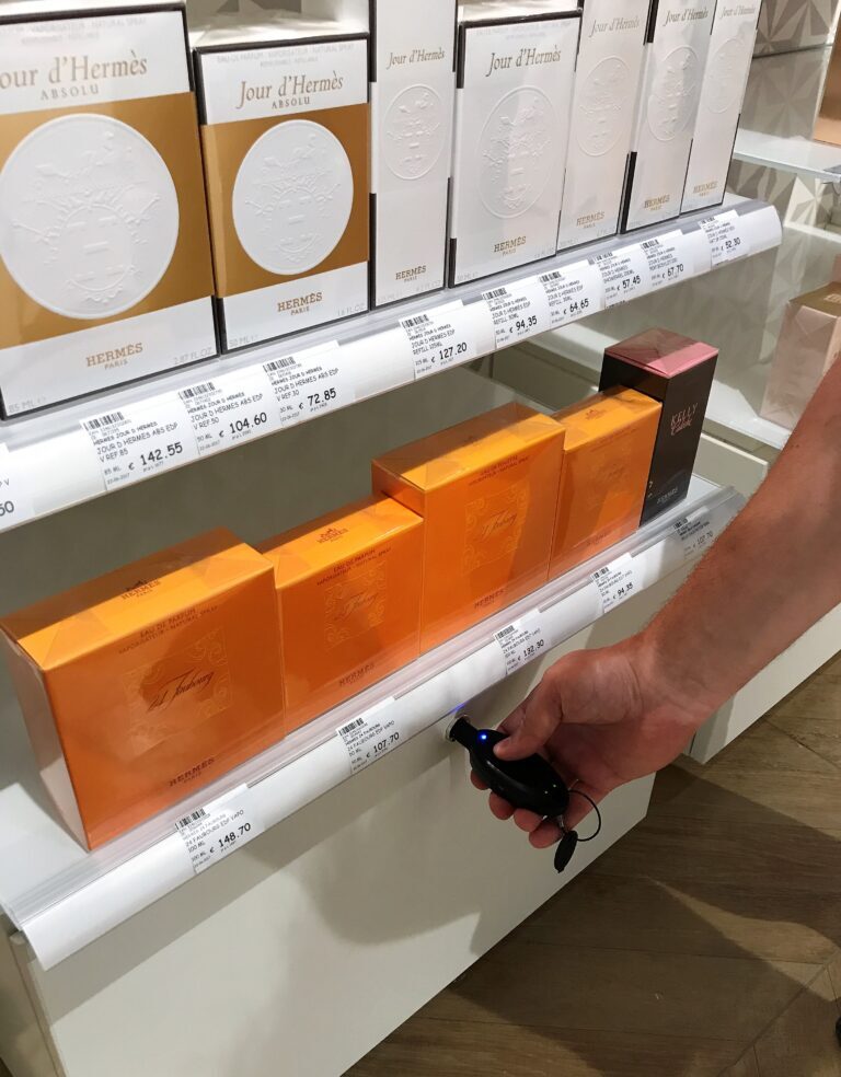 Drawer with smart lock securing stock of perfumes and fragrances for associates to hand out to customers or restock testers.