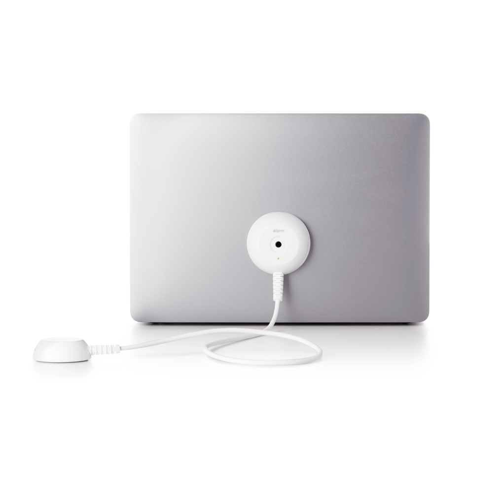 White Laptop AOP attached to a silver laptop