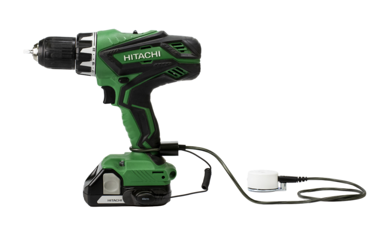 Zips securing a green Hitachi drill