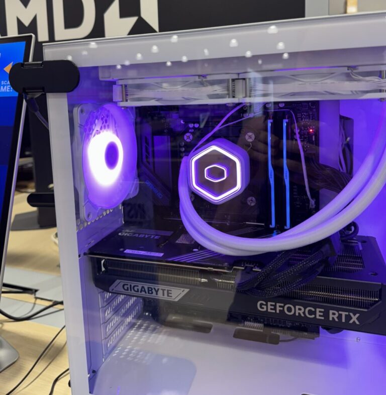 Desktop Lock securing a gaming computer tower with RAM and graphic card installed