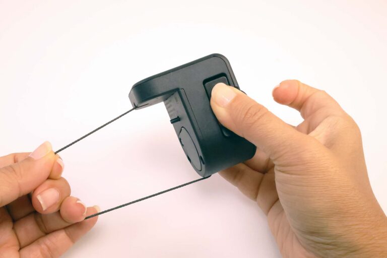 InVue's Corner Package Wrap has auto-retracting cable management